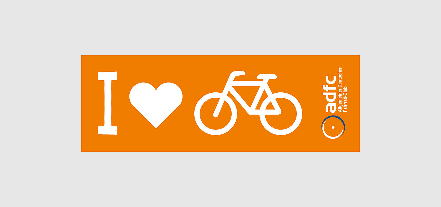 Aufkleber orange, lang für die Fahrradstange, mit weißer Schrift und Symbolen, großes i, Herz, Fahrrad, sowie das ADFC-Logo